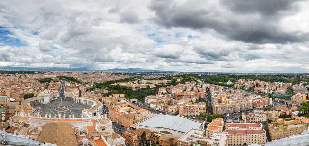 Cloudy panoramic view of Vatican and Rome from the top of the dome of St Peter's Basilica, Lazio region, Italy.
