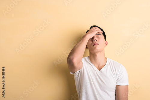 sad Asian young man
