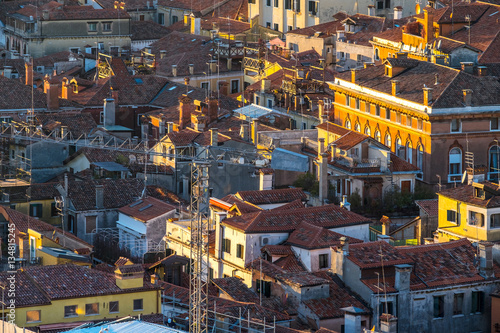 Aerial view of Venice  Italy  at sunset with rooftops of buildings and vintage colors in winter sunset.
