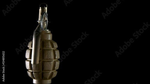 grenade rotates on a black background photo