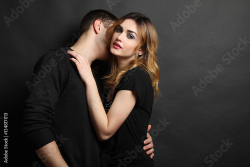 Young man hugging his girlfriend.