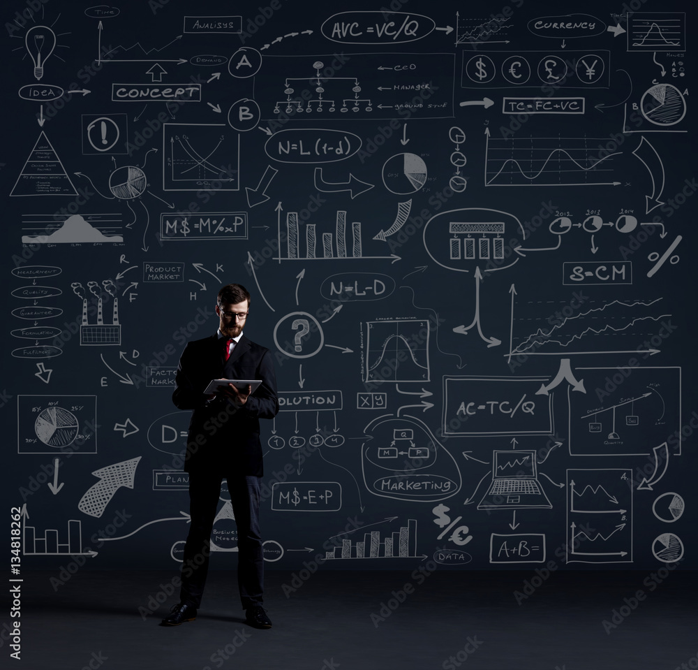 Businessman with a tablet on a graph background Businessman with a tablet on a graph background