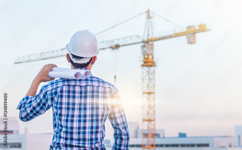 Portrait of architect wear white helmet safty hold the blueprint Portrait of architect wear white helmet safty hold the blueprint