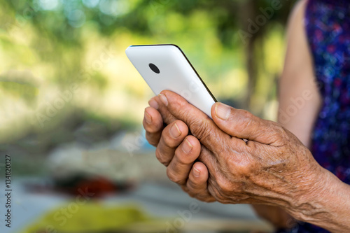 Impress, older person, holding smartphone