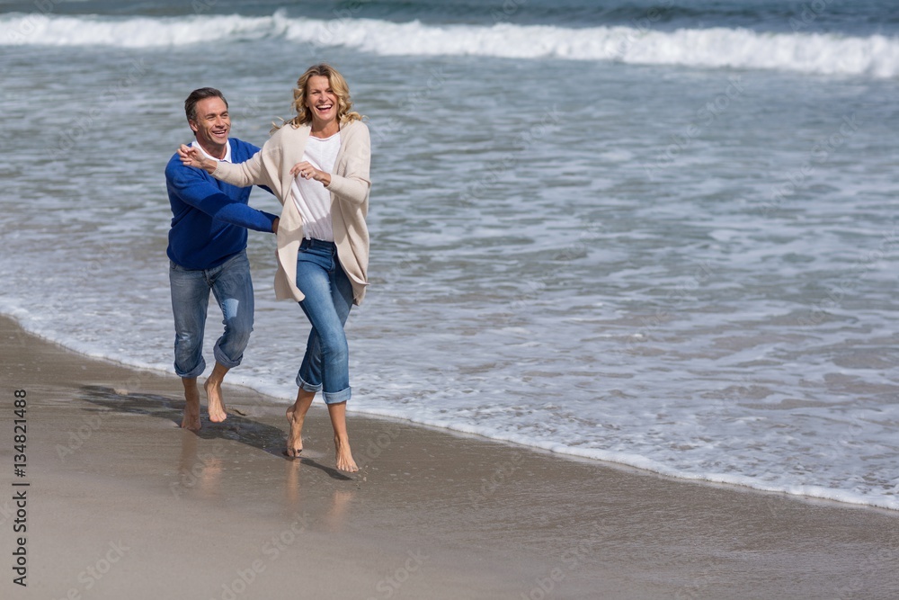 Mature couple enjoying on the beach