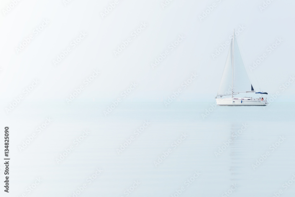 Sailing boat on Blue sea with Foggy Weather. Sailing Ship on The Lake Balaton.