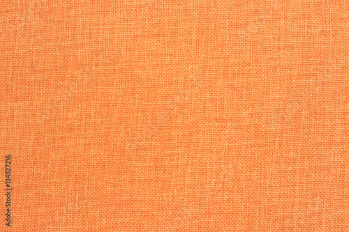 A pattern of a orange fabric filling the frame