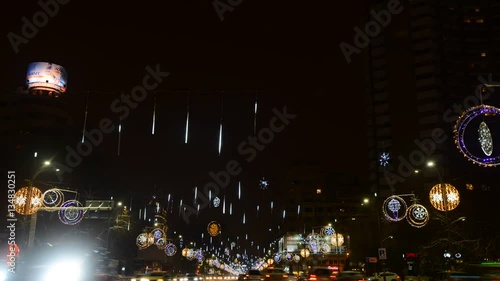 Night traffic with car pass, Christmas decorations in University Square, time lapse 