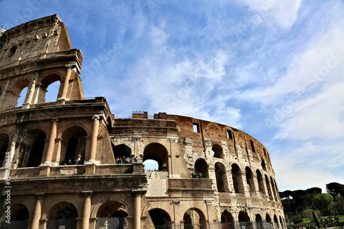 ROME, ITALY - APRIL 3, 2014: The Colosseum - a monument of architecture of ancient Rome in the spring sunny day photo