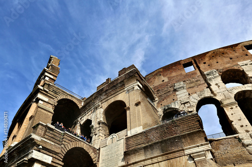 ROME, ITALY - APRIL 3, 2014: The Colosseum - a monument of architecture of ancient Rome in the spring sunny day photo