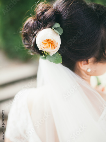 brides hairstyle,rose in hair