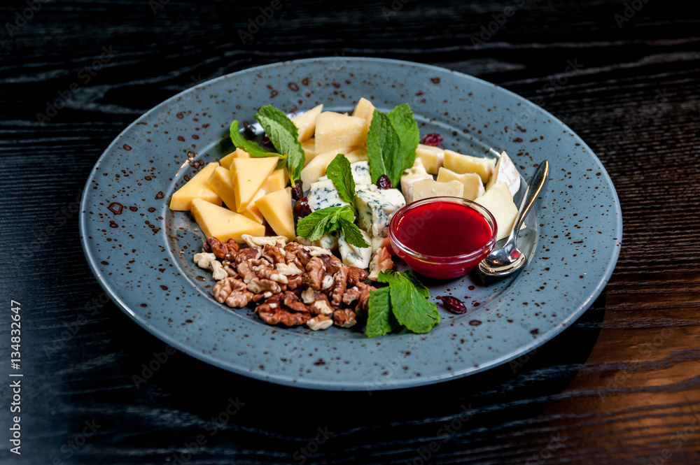 Sliced cheese with nuts Sliced cheese with nuts