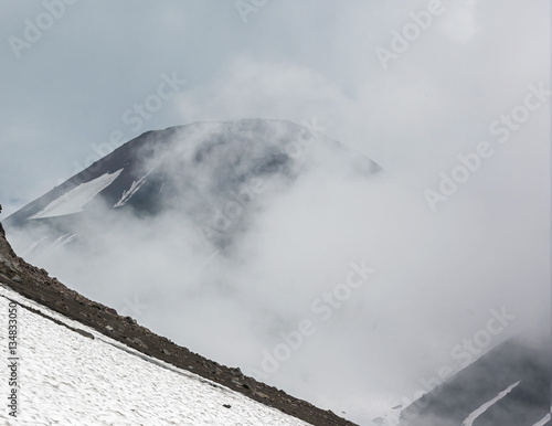 Cloudly landscape at the foot of the volcano Avachinsky - Kamchatka, Russia photo