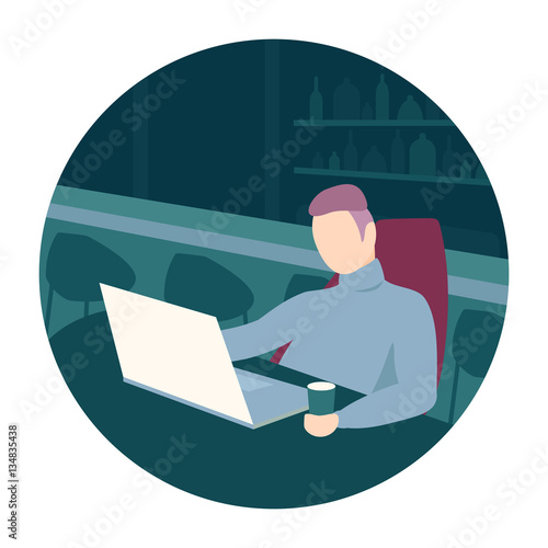 Man sitting in a bar with laptop