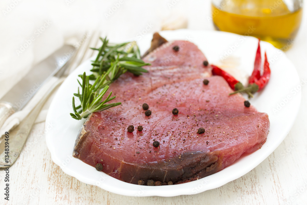 raw tuna with black pepper on white dish raw tuna with black pepper on white dish