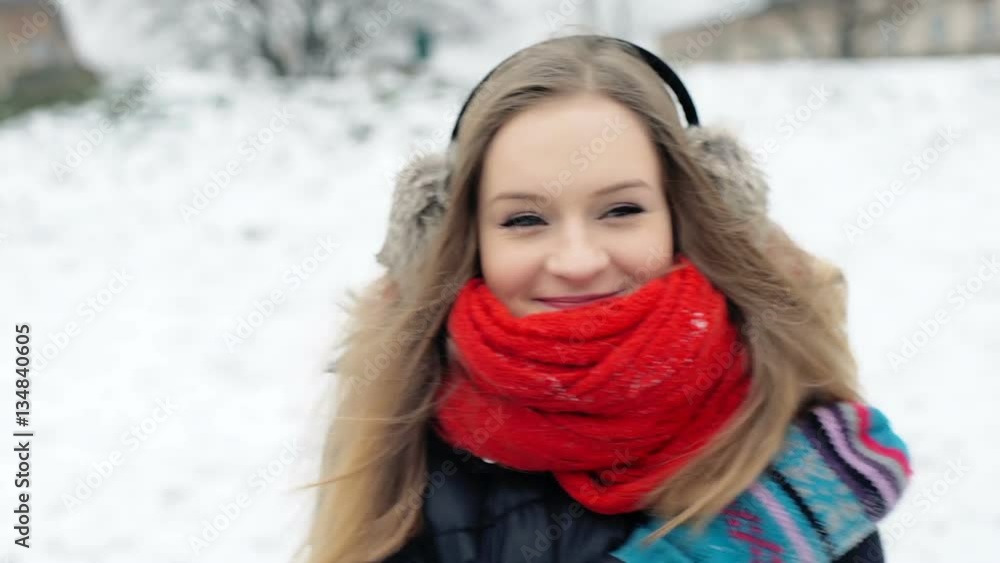 Pretty girl standing in the park at winter time and warming herself, steadycam shot
Pretty girl standing in the park at winter time and warming herself, steadycam shot