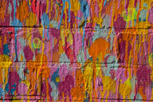 Multi color paint on brick wall