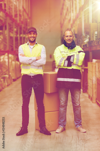 men in uniform with boxes at warehouse