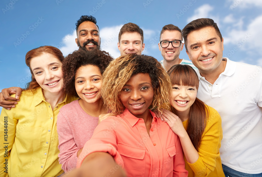 international group of happy people taking selfie international group of happy people taking selfie