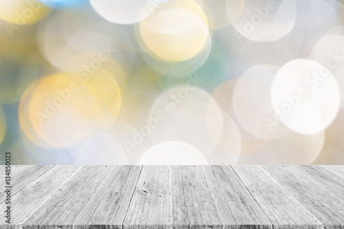 Abstract bokeh of light with white wood terrace