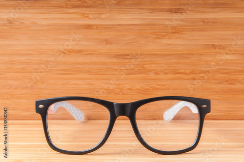 Glasses on wooden table.