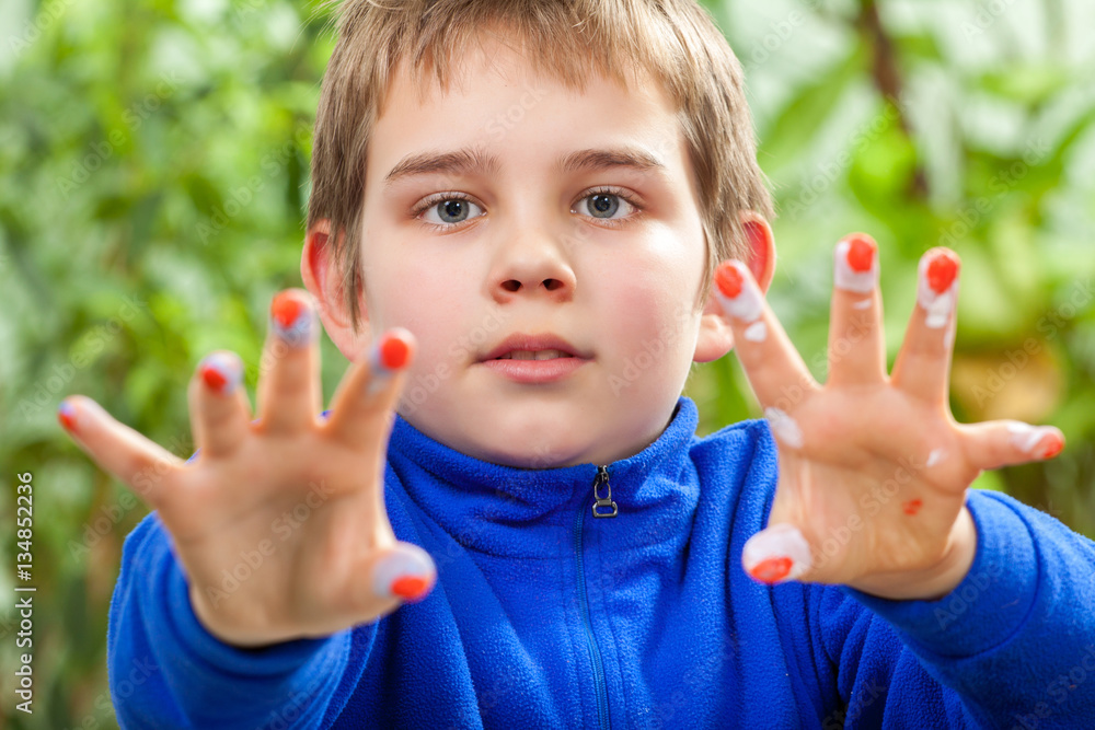 Mother and her children paint easter eggs