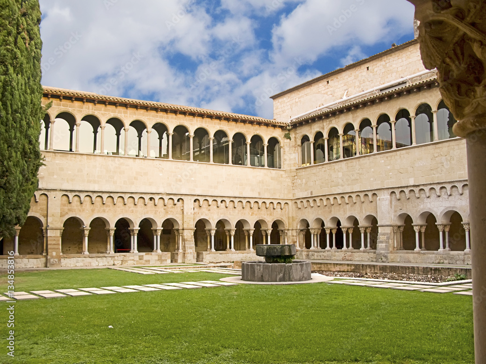 Gothic abbey monastery and cloister from garden perspective, in