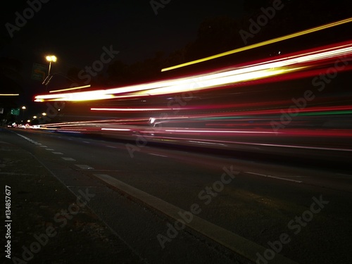 Car light trails on the road, movement in Thailand.