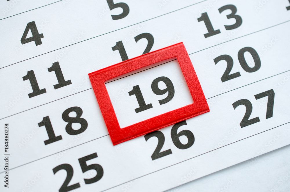 White paper calendar with the number 19 in the red box White paper calendar with the number 19 in the red box