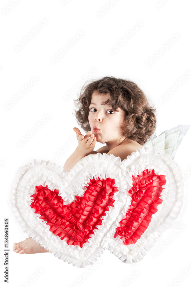 Little curly angel sitting half-turned, and sends a kiss to the camera. Close-up. White background. Little curly angel sitting half-turned, and sends a kiss to the camera. Close-up. White background.
