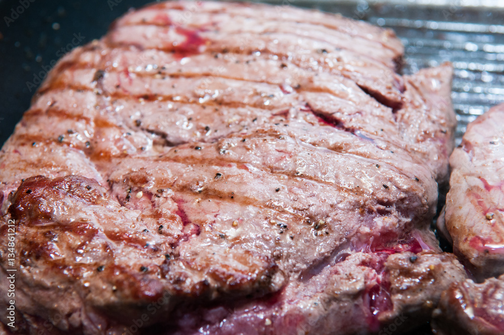 Steak dinner cooking on the grill Steak dinner cooking on the grill