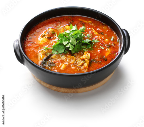 moqueca capixaba, brazilian fish stew isolated on white background