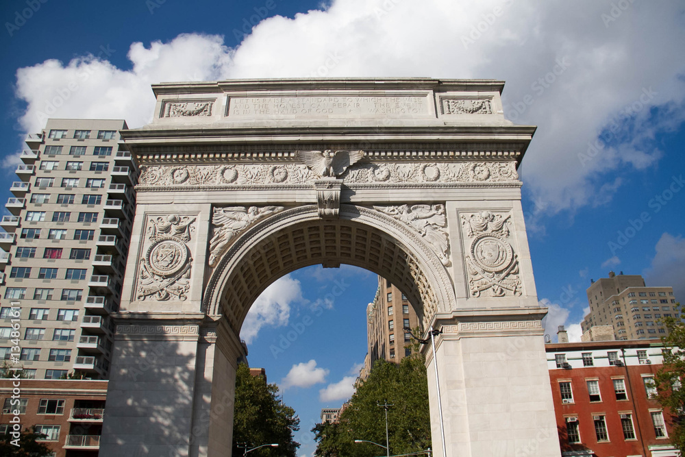 Washington Square Park Arch and buildings with cloudy blue sky