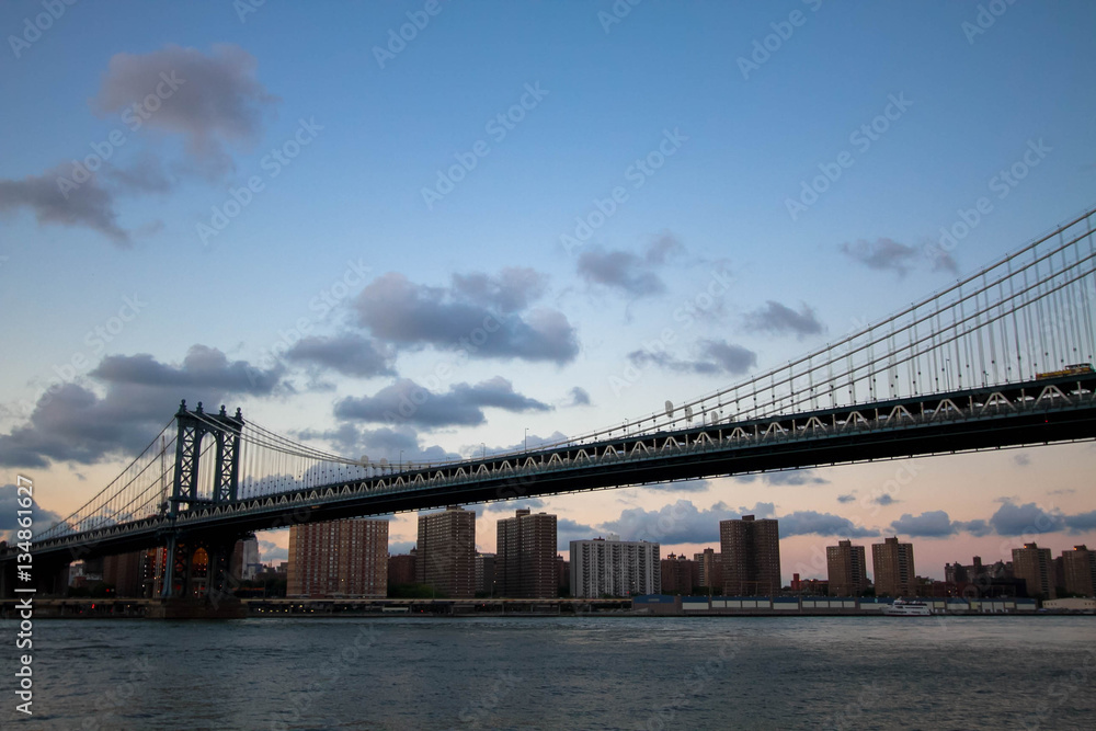 Manhattan bridge over the river in the evening