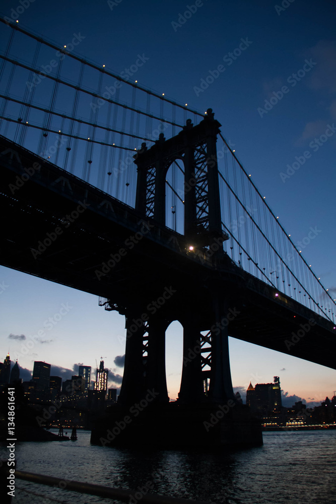 Manhattan bridge in silhouette at night, New York