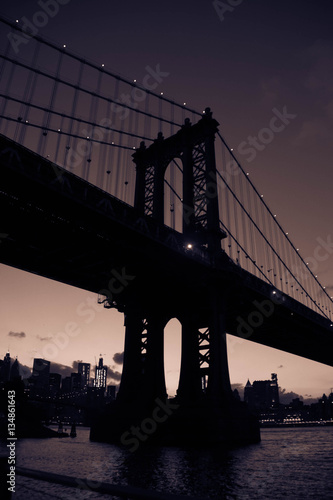Manhattan bridge in silhouette in purple vintage color style