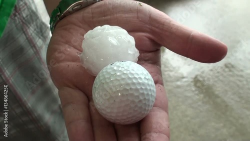 Golf Ball Hail Held in Hand