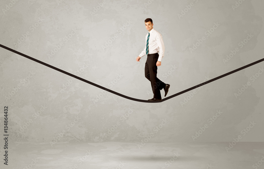Salesman walking on rope in grey space Salesman walking on rope in grey space