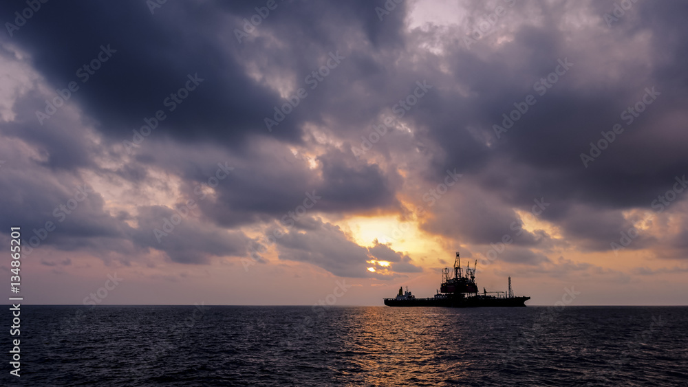 Drilling rig in Sunset