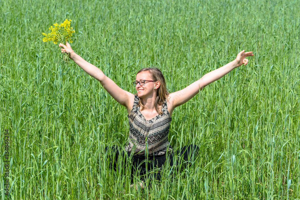 Happy woman with flowers on summer field Happy woman with flowers on summer field
