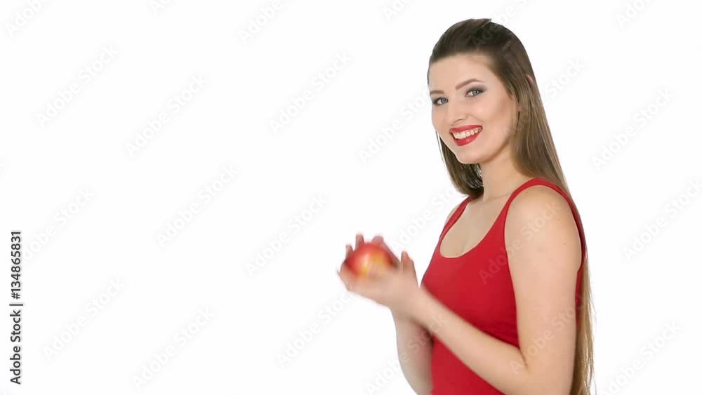 woman holding red Apple and smiling on white background woman holding red Apple and smiling on white background