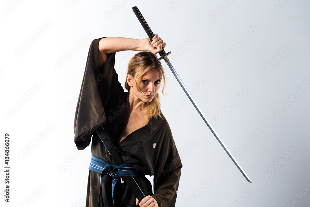 Blonde woman dressed like samurai with a katana Blonde woman dressed like samurai with a katana