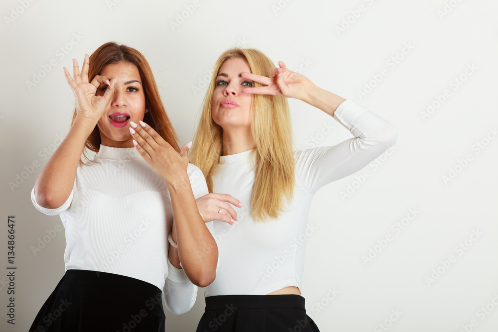 Two crazy girls playing around together.