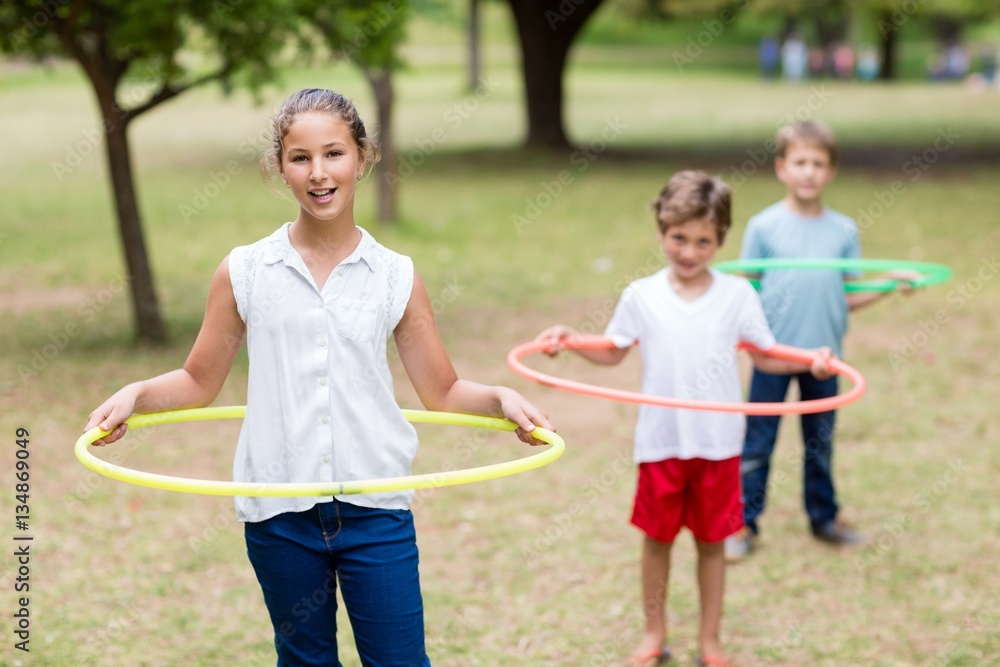 Kids playing with hula hoop Kids playing with hula hoop