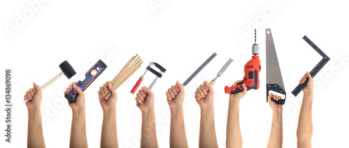 Canvastavla Hands holding tools on white background