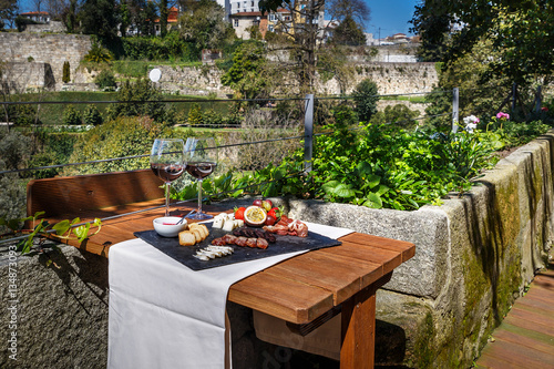 Table set with wine, chese and fruit