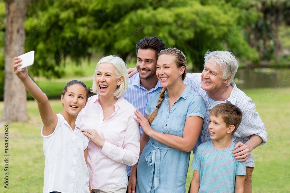 Multi-generation family taking a selfie on a mobile phone Multi-generation family taking a selfie on a mobile phone