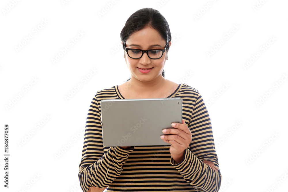 Young happy Woman using a tablet computer against white backgrou