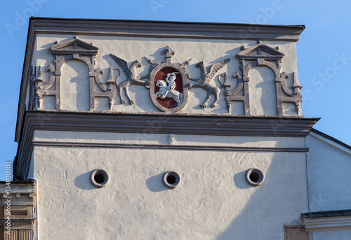 Coat of arms of Lithuania in Ausros gate (gate of dawn) with basilica of Madonna Ostrobramska in Vilnius, Lithuania photo