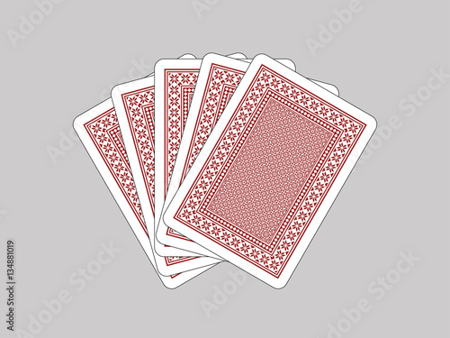 Five closed playing cards on grey background